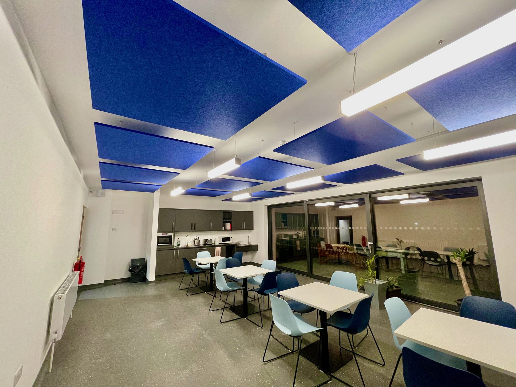 Acoustic ceiling treatment installed in a school space
